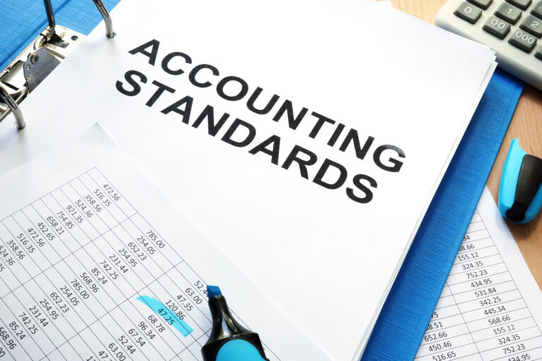 folder with documents that says accounting standards on a table